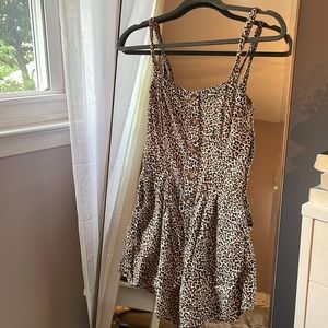 Cheetah print romper with buttons and pockets